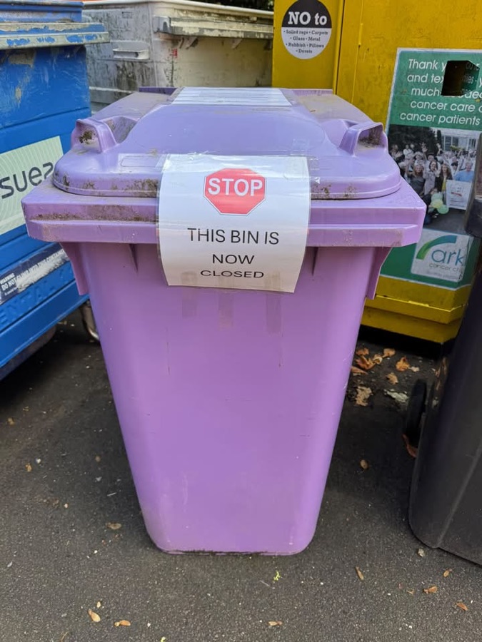 A purple Village Magpies bin with a 'This bin is now closed' sign